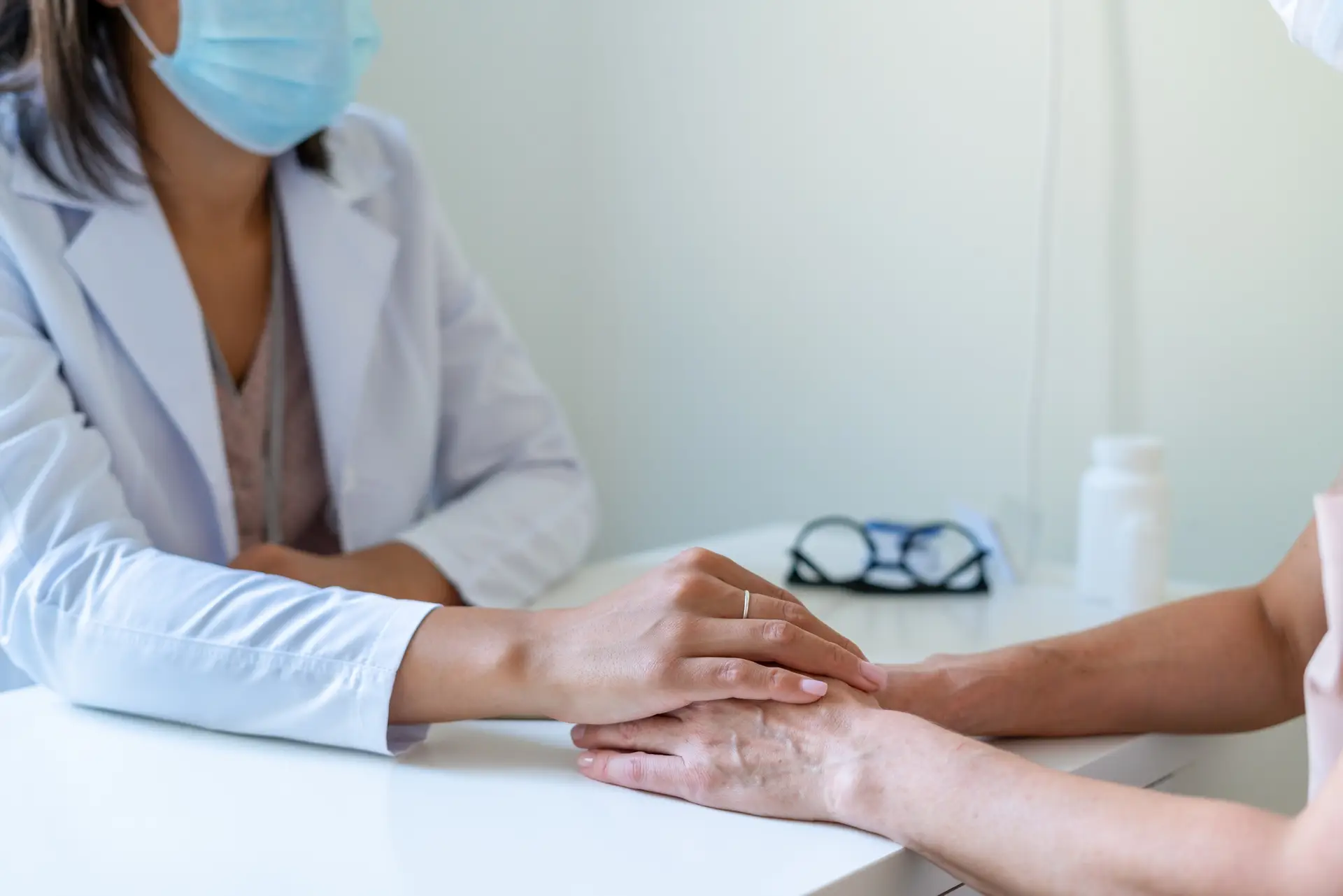 Doctor supporting sick patient. Announcing bad diagnose to coronavirus sufferer